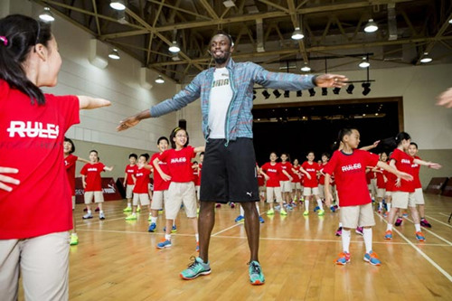 Usain Bolt visited a primary School in Shanghai last year. Photo provided to chinadaily.com.cn Usain Bolt visited a primary School in Shanghai last year. Photo provided to chinadaily.com.cn