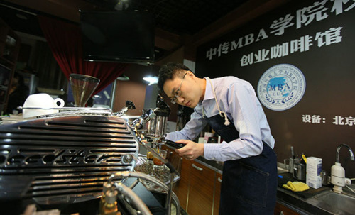 Liang Chen, 33, who graduated with an MBA from Communication University of China in 2012, works at the coffee store he founded near the school in Beijing. His business is brisk and he is planning to expand his business.(A Jing/China Daily) Liang Chen, 33, who graduated with an MBA from Communication University of China in 2012, works at the coffee store he founded near the school in Beijing. His business is brisk and he is planning to expand his business.(A Jing/China Daily)
