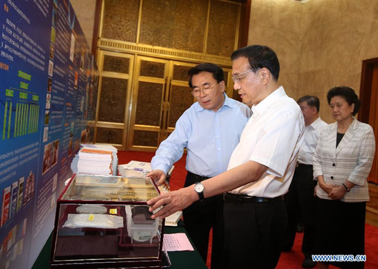 Chinese Premier Li Keqiang visits a display of the history and acheivements of the Academic Divisions of the Chinese Academy of Sciences (CAS) before a symposium on science and technology strategy in Beijing, China, July 27, 2015. (Xinhua/Pang Xinglei) Chinese Premier Li Keqiang visits a display of the history and acheivements of the Academic Divisions of the Chinese Academy of Sciences (CAS) before a symposium on science and technology strategy in Beijing, China, July 27, 2015. (Xinhua/Pang Xinglei)
