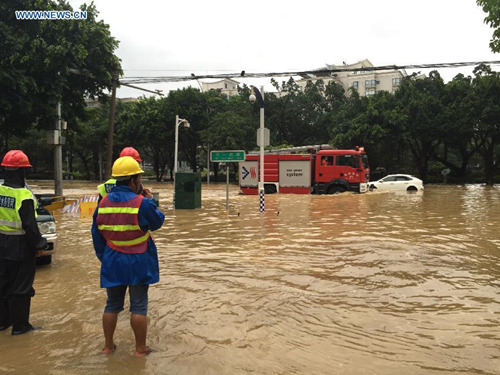 Vehicles run on a waterlogged road in downtown Fuzhou, southeast China's Fujian Province, Aug. 9, 2015. Typhoon Soudelor stormed through Fujian after it landed in the province on Saturday night, causing urban waterlogging in the capital city of Fuzhou. (Photo: Xinhua/Jiang Kehong) Vehicles run on a waterlogged road in downtown Fuzhou, southeast China's Fujian Province, Aug. 9, 2015. Typhoon Soudelor stormed through Fujian after it landed in the province on Saturday night, causing urban waterlogging in the capital city of Fuzhou. (Photo: Xinhua/Jiang Kehong)