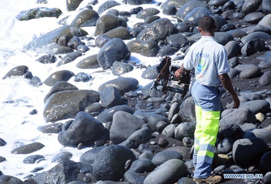 A searcher searches the Saint Andre Beach of France's overseas island La Reunion in the Indian Ocean, where the first piece of debris from the missing Malaysian Airlines flight MH370 was found, on Aug. 10, 2015. France on Aug. 7 announced that hunts for more MH370 debris will continue for at least a week off la Reunion after a wing section was spotted near the island. (Photo: Xinhua/Zhang Chuanshi) A searcher searches the Saint Andre Beach of France's overseas island La Reunion in the Indian Ocean, where the first piece of debris from the missing Malaysian Airlines flight MH370 was found, on Aug. 10, 2015. France on Aug. 7 announced that hunts for more MH370 debris will continue for at least a week off la Reunion after a wing section was spotted near the island. (Photo: Xinhua/Zhang Chuanshi)