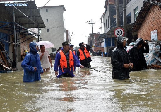Rescuers wade through floodwater at Chengli Village of Sandu Town in Ningde City, southeast China's Fujian Province, Aug. 9, 2015. Typhoon Soudelor stormed through Fujian after it landed in the province on Saturday night. (Photo: Xinhua/Yuan Ziyou) Rescuers wade through floodwater at Chengli Village of Sandu Town in Ningde City, southeast China's Fujian Province, Aug. 9, 2015. Typhoon Soudelor stormed through Fujian after it landed in the province on Saturday night. (Photo: Xinhua/Yuan Ziyou)