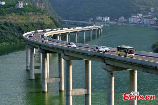 A new highway elevated above water has been officially opened in Xingshan county, Central China’s Hubei province, Aug 9, 2015. To avoid cutting through forest or tunneling through earth, an approximately 4km stretch of highway has been built above a river that runs through mountains. Those involved in the project are claiming it to be China’s first “ecological overwater road”. (Photo: China News Service/Liu Liangwei) A new highway elevated above water has been officially opened in Xingshan county, Central China’s Hubei province, Aug 9, 2015. To avoid cutting through forest or tunneling through earth, an approximately 4km stretch of highway has been built above a river that runs through mountains. Those involved in the project are claiming it to be China’s first “ecological overwater road”. (Photo: China News Service/Liu Liangwei)