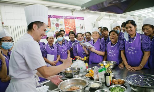 Trainees at Meiyu Home Services have a cooking lesson on August 14. (Photo: Li Hao/GT) Trainees at Meiyu Home Services have a cooking lesson on August 14. (Photo: Li Hao/GT)