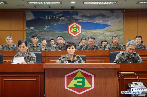 South Korean President Park Geun-hye (C, front) is seen at the headquarters of the Third Army in South Korea on Aug. 21, 2015. South Korea's top military officer on Friday warned the Democratic People's Republic of Korea (DPRK) of a harsh price for any further provocations. (Photo:Xinhua/Seigadai Palace) South Korean President Park Geun-hye (C, front) is seen at the headquarters of the Third Army in South Korea on Aug. 21, 2015. South Korea's top military officer on Friday warned the Democratic People's Republic of Korea (DPRK) of a harsh price for any further provocations. (Photo:Xinhua/Seigadai Palace)