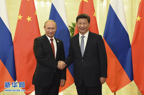 Chinese President Xi Jinping shakes hands with visiting Russian President Vladimir Putin in Beijing, Sept 3, 2015. (Photo/Xinhua) Chinese President Xi Jinping shakes hands with visiting Russian President Vladimir Putin in Beijing, Sept 3, 2015. (Photo/Xinhua)