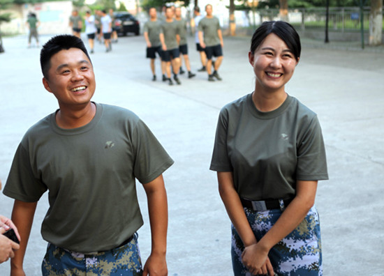 Lieutenant Li Yiming (left) from the PLA Combined Band and his fiancee, Su Ya, planned to register for marriage after the parade. (Photo/China Daily) Lieutenant Li Yiming (left) from the PLA Combined Band and his fiancee, Su Ya, planned to register for marriage after the parade. (Photo/China Daily)