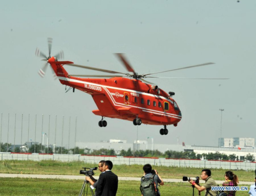 A helicopter practises for the coming China Helicopter Exposition in a helicopter base of Aviation Industry Corporation of China in the Airport Area of China Pilot Free Trade Zone of Tianjin, north China, Sept. 7, 2015. The exposition will be opened on Sept. 9. (Photo: Xinhua/Wang Huan) A helicopter practises for the coming China Helicopter Exposition in a helicopter base of Aviation Industry Corporation of China in the Airport Area of China Pilot Free Trade Zone of Tianjin, north China, Sept. 7, 2015. The exposition will be opened on Sept. 9. (Photo: Xinhua/Wang Huan)