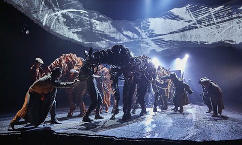 Puppet horses Joey (left) and Topthorn pull military vehicles driven by German soldiers in a scene from stage play War Horse. Photo: Courtesy of the Chinese production of War Horse Puppet horses Joey (left) and Topthorn pull military vehicles driven by German soldiers in a scene from stage play War Horse. Photo: Courtesy of the Chinese production of War Horse