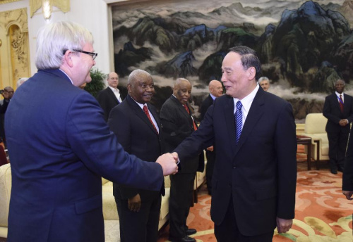 Wang Qishan (R), a member of the Standing Committee of the Political Bureau of the Communist Party of China (CPC) Central Committee and head of the CPC Central Commission for Discipline Inspection (CCDI), meets with overseas attendants of The Party and World Dialogue 2015 in Beijing, capital of China, Sept. 9, 2015.(Photo: Xinhua/Li Xueren) Wang Qishan (R), a member of the Standing Committee of the Political Bureau of the Communist Party of China (CPC) Central Committee and head of the CPC Central Commission for Discipline Inspection (CCDI), meets with overseas attendants of The Party and World Dialogue 2015 in Beijing, capital of China, Sept. 9, 2015.(Photo: Xinhua/Li Xueren)