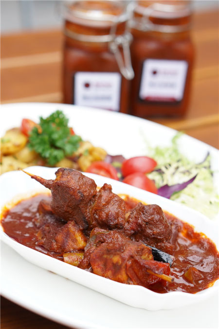 Kebabs with curry sauce by German culinary masters Timo Winter and Dietmar Haubold. Photo provided to China Daily Kebabs with curry sauce by German culinary masters Timo Winter and Dietmar Haubold. Photo provided to China Daily