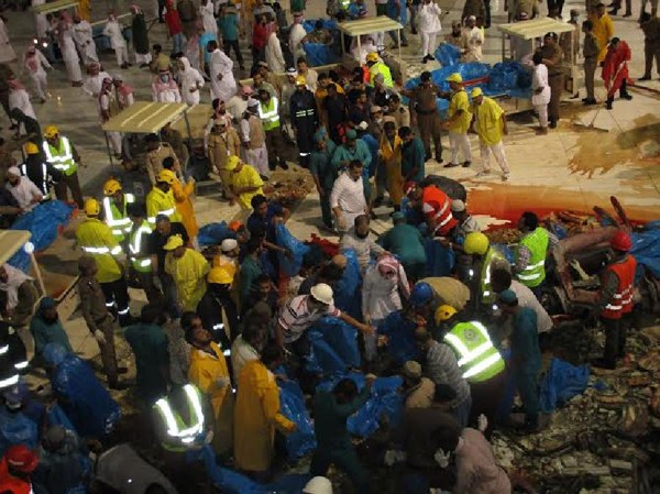 Saudi emergency teams gather inside the Grand Mosque of Saudi Arabia's holy Muslim city of Mecca after a construction crane crashed into it, on Sept. 11, 2015. 87 pilgrims were killed and 201 others were injured when a crane fell on the grand mosque in Mecca, Saudi Arabia's Civil Defence authority said Friday. Al Arabiya Television earlier said the crane had fallen because of strong storms. Saudi Arabia has been hit by strong sand storms in the last few days. (Xinhua/Str.) Saudi emergency teams gather inside the Grand Mosque of Saudi Arabia's holy Muslim city of Mecca after a construction crane crashed into it, on Sept. 11, 2015. 87 pilgrims were killed and 201 others were injured when a crane fell on the grand mosque in Mecca, Saudi Arabia's Civil Defence authority said Friday. Al Arabiya Television earlier said the crane had fallen because of strong storms. Saudi Arabia has been hit by strong sand storms in the last few days. (Xinhua/Str.)