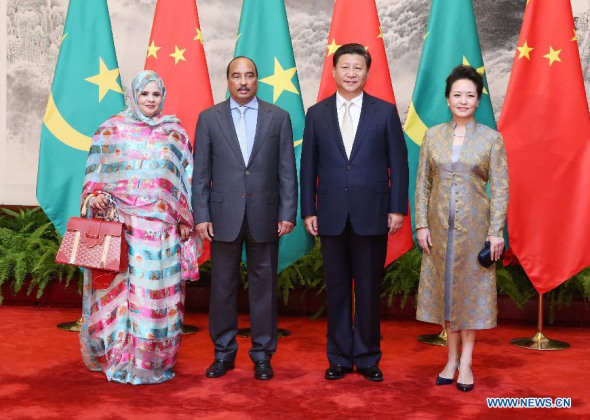 Chinese President Xi Jinping (2nd R) and his wife Peng Liyuan (1st R) pose for a group photo with Mauritanian President Mohamed Ould Abdel Aziz (2nd L) and his wife at the Great Hall of the People in Beijing, capital of China, Sept. 14, 2015. (Photo: Xinhua/Yao Dawei) Chinese President Xi Jinping (2nd R) and his wife Peng Liyuan (1st R) pose for a group photo with Mauritanian President Mohamed Ould Abdel Aziz (2nd L) and his wife at the Great Hall of the People in Beijing, capital of China, Sept. 14, 2015. (Photo: Xinhua/Yao Dawei)