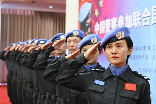 Ye Lixin (front) is among the 12 members of the 14th group of Chinese peacekeeping police officers being sent as part of the United Nations peacekeeping mission in Liberia. The group, which will depart on Thursday for Liberia, held a ceremony in Beijing on Wednesday. (Photo by Wang Zhuangfei/ China Daily) Ye Lixin (front) is among the 12 members of the 14th group of Chinese peacekeeping police officers being sent as part of the United Nations peacekeeping mission in Liberia. The group, which will depart on Thursday for Liberia, held a ceremony in Beijing on Wednesday. (Photo by Wang Zhuangfei/ China Daily)