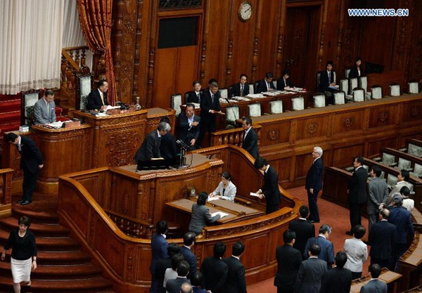 Japan's lawmakers line up to cast their ballots during a plenary session for a vote on security laws at the upper house of the parliament in Tokyo, Japan, on Sept. 19, 2015. Japan abandoned its 70-year pacifism since the end of World War II as the parliament's upper house on early Saturday enacted a controversial legislation pushed forward by the government under Prime Minister Shinzo Abe. (Xinhua/Ma Ping) Japan's lawmakers line up to cast their ballots during a plenary session for a vote on security laws at the upper house of the parliament in Tokyo, Japan, on Sept. 19, 2015. Japan abandoned its 70-year pacifism since the end of World War II as the parliament's upper house on early Saturday enacted a controversial legislation pushed forward by the government under Prime Minister Shinzo Abe. (Xinhua/Ma Ping)