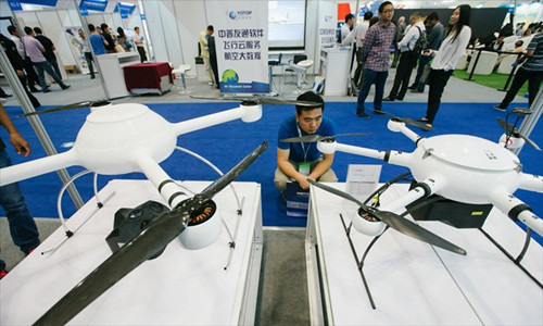 A visitor looks at two drones produced by Chinese company Space Geodata on September 16 at an aviation expo in Beijing. (Photo: Li Hao/GT) A visitor looks at two drones produced by Chinese company Space Geodata on September 16 at an aviation expo in Beijing. (Photo: Li Hao/GT)