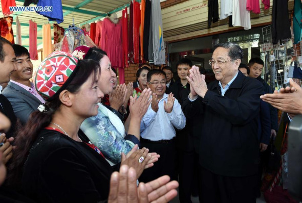 Yu Zhengsheng (R), chairman of the National Committee of the Chinese People's Political Consultative Conference (CPPCC), greets local residents of Uygur ethnic group while visiting a village in Elixku Township, Shache County of Kashgar, northwest China's Xinjiang Uygur Autonomous Region, Sept. 27, 2015. (Photo: Xinhua/Rao Aimin) Yu Zhengsheng (R), chairman of the National Committee of the Chinese People's Political Consultative Conference (CPPCC), greets local residents of Uygur ethnic group while visiting a village in Elixku Township, Shache County of Kashgar, northwest China's Xinjiang Uygur Autonomous Region, Sept. 27, 2015. (Photo: Xinhua/Rao Aimin)