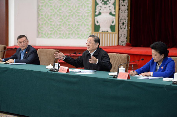 Yu Zhengsheng (C), chairman of the National Committee of the Chinese People's Political Consultative Conference (CPPCC), speaks while hearing a work report by Xinjiang Party and government, in Urumqi, northwest China's Xinjiang Uygur Autonomous Region, Sept. 30, 2015. (Xinhua/Zhang Ling) Yu Zhengsheng (C), chairman of the National Committee of the Chinese People's Political Consultative Conference (CPPCC), speaks while hearing a work report by Xinjiang Party and government, in Urumqi, northwest China's Xinjiang Uygur Autonomous Region, Sept. 30, 2015. (Xinhua/Zhang Ling)