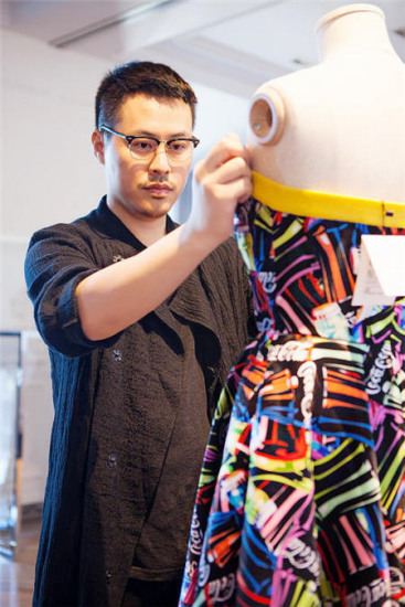 Christopher Bu works on the collection featuring jackets, skirts and dresses, inspired by Coca-Cola's logos, shapes and palette. (Photo provided to China Daily) Christopher Bu works on the collection featuring jackets, skirts and dresses, inspired by Coca-Cola's logos, shapes and palette. (Photo provided to China Daily)