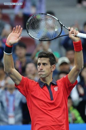 Novak Djokovic of Serbia celebrates his victory over Zhang Ze of China during the men's singles second round match at the China Open tennis tournament in Beijing, China, Oct. 8, 2015. Djokovic was qualified for the next round after beating Zhang 2-0. (Photo: Xinhua/Xing Guangli) Novak Djokovic of Serbia celebrates his victory over Zhang Ze of China during the men's singles second round match at the China Open tennis tournament in Beijing, China, Oct. 8, 2015. Djokovic was qualified for the next round after beating Zhang 2-0. (Photo: Xinhua/Xing Guangli)
