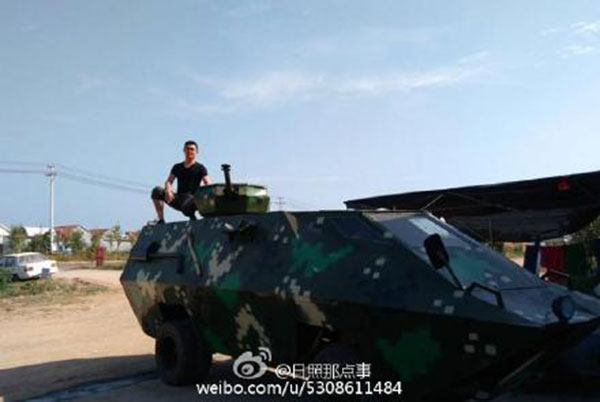 Shi poses with his armored car. (Photo/Sina Weibo) Shi poses with his armored car. (Photo/Sina Weibo)