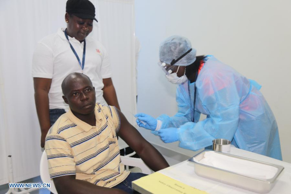 A local resident of Sierra Leone is injected with the China-developed Ebola vaccine at Sierra Leone-China Friendship Hospital, some 30 kilometres from Freetown, capital of Sierra Leone, on Oct. 10, 2015. A vaccine against the Ebola virus, developed by Chinese and being tested in Sierra Leone, is so far clinically safe, an official has said. (Photo: Xinhua/Wu Shibo) A local resident of Sierra Leone is injected with the China-developed Ebola vaccine at Sierra Leone-China Friendship Hospital, some 30 kilometres from Freetown, capital of Sierra Leone, on Oct. 10, 2015. A vaccine against the Ebola virus, developed by Chinese and being tested in Sierra Leone, is so far clinically safe, an official has said. (Photo: Xinhua/Wu Shibo)