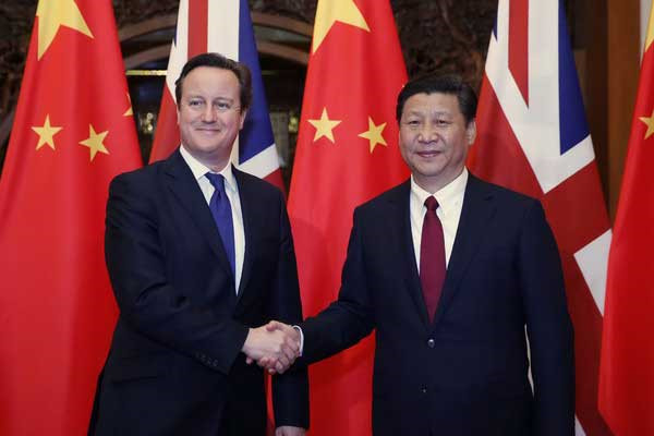 President Xi Jinping shakes hands with visiting British Prime Minister David Cameron in Beijing, Dec 2, 2013. (Photo/Xinhua)
