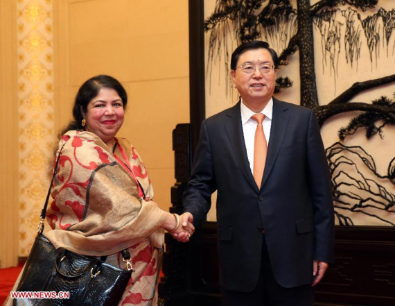 Zhang Dejiang, chairman of the Standing Committee of the National People's Congress, shakes hands with Speaker of the Bangladesh National Assembly Shirin Sharmin Chowdhury at the Great Hall of the People in Beijing, China, Oct. 15, 2015. (Photo: Xinhua/Liu Weibing) Zhang Dejiang, chairman of the Standing Committee of the National People's Congress, shakes hands with Speaker of the Bangladesh National Assembly Shirin Sharmin Chowdhury at the Great Hall of the People in Beijing, China, Oct. 15, 2015. (Photo: Xinhua/Liu Weibing)