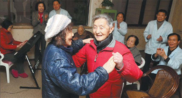 A couple dances in the entertainment room at a nursing home in Shanghai's Hongkou district. Converted from a seven-story hotel, the nursing home can accommodate about 300 people. Pei Xin / Xinhua A couple dances in the entertainment room at a nursing home in Shanghai's Hongkou district. Converted from a seven-story hotel, the nursing home can accommodate about 300 people. Pei Xin / Xinhua