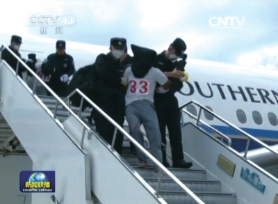 A screen grab from state broadcaster CCTV shows that illegal immigrants were repatriated from Thailand to China on July 9, 2015. A screen grab from state broadcaster CCTV shows that illegal immigrants were repatriated from Thailand to China on July 9, 2015.