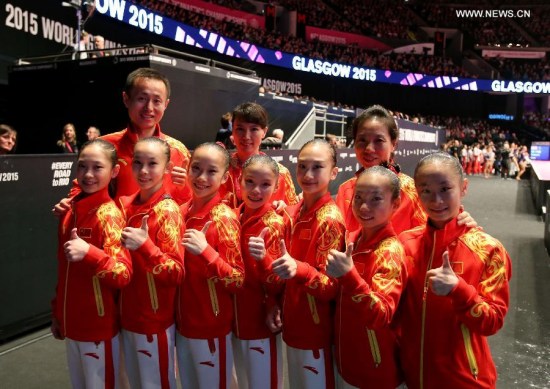 Chinese gymnasts pose with their coaches after the women's team final at the 46th World Artistic Gymnastics Championships at the SSE Hydro Arena in Glasgow, Scotland, Great Britain on Oct. 27, 2015. China won the silver medals. (Photo: Xinhua/Han Yan) Chinese gymnasts pose with their coaches after the women's team final at the 46th World Artistic Gymnastics Championships at the SSE Hydro Arena in Glasgow, Scotland, Great Britain on Oct. 27, 2015. China won the silver medals. (Photo: Xinhua/Han Yan)