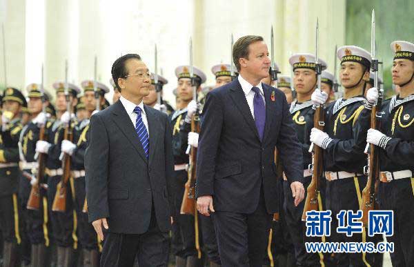 British Prime Minister David Cameron is welcomed by then Premier Wen Jiabao after arriving Beijing for state visit, Nov 9, 2010. (Photo/Xinhua) British Prime Minister David Cameron is welcomed by then Premier Wen Jiabao after arriving Beijing for state visit, Nov 9, 2010. (Photo/Xinhua)
