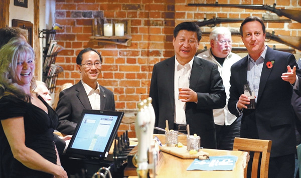 President Xi Jinping and Prime Minister David Cameron visit a pub in Princess Risborough, near Chequers, England, on Thursday. (PHOTO BY WU ZHIYI/CHINA DAILY) President Xi Jinping and Prime Minister David Cameron visit a pub in Princess Risborough, near Chequers, England, on Thursday. (PHOTO BY WU ZHIYI/CHINA DAILY)