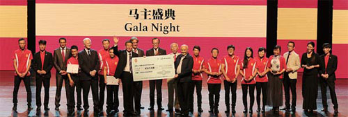 China Horse Club representative Owen Glenn (10th from right) presents a check worth 200,000 yuan ($31,496) to the Inner Mongolia Agriculture University with CHC Chairman Teo Ah Khing (standing behind the check) and President of the International Federation of Horseracing Authorities Louis Romanet (fifth from left). (Photo Provided to China Daily) China Horse Club representative Owen Glenn (10th from right) presents a check worth 200,000 yuan ($31,496) to the Inner Mongolia Agriculture University with CHC Chairman Teo Ah Khing (standing behind the check) and President of the International Federation of Horseracing Authorities Louis Romanet (fifth from left). (Photo Provided to China Daily)
