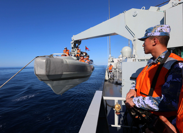The Chinese missile destroyer Jinan prepares to rescue a small naval vessel as part of the first joint military drill to be staged between China and the U.S. in the Atlantic Ocean. The six-hour exercise took place on Saturday and each country sent three warships. (Photo/Xinhua) The Chinese missile destroyer Jinan prepares to rescue a small naval vessel as part of the first joint military drill to be staged between China and the U.S. in the Atlantic Ocean. The six-hour exercise took place on Saturday and each country sent three warships. (Photo/Xinhua)