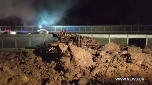Photo taken with a mobile phone shows the accident site after a landslide hit Lidong Village in Lishui City, east China's Zhejiang Province, Nov. 14, 2015. Four people were confirmed dead and 33 others remained missing after the landslide occurred Friday night.(Xinhua) Photo taken with a mobile phone shows the accident site after a landslide hit Lidong Village in Lishui City, east China's Zhejiang Province, Nov. 14, 2015. Four people were confirmed dead and 33 others remained missing after the landslide occurred Friday night.(Xinhua)