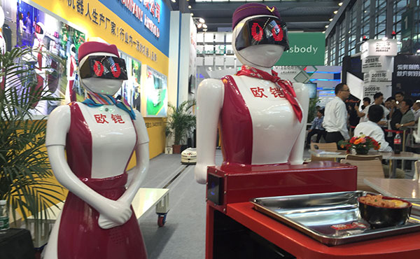 Smart waitresses, developed by Shenzhen Okagv Company Limited, are seen at the China Hi-tech Fair, which opens in Shenzhen, Guangdong province, on November 16, 2015. (Photo by Qiu Quanlin/China Daily) Smart waitresses, developed by Shenzhen Okagv Company Limited, are seen at the China Hi-tech Fair, which opens in Shenzhen, Guangdong province, on November 16, 2015. (Photo by Qiu Quanlin/China Daily)