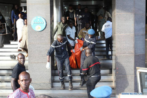 Rescue team members carry out a body of a victim from the Radisson Blu hotel in Bamako, Mali, Nov. 20, 2015. (Xinhua/Stringer) Rescue team members carry out a body of a victim from the Radisson Blu hotel in Bamako, Mali, Nov. 20, 2015. (Xinhua/Stringer)