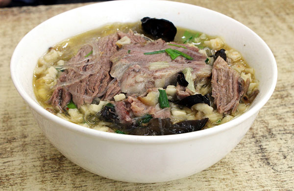Pita bread in mutton soup is among Xi'an's delicacies. CHINA DAILY Pita bread in mutton soup is among Xi'an's delicacies. CHINA DAILY