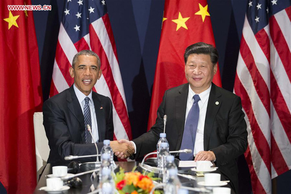 Chinese President Xi Jinping (R) meets with his U.S. counterpart Barack Obama in Paris, France, Nov. 30, 2015. (Xinhua/Huang Jingwen)