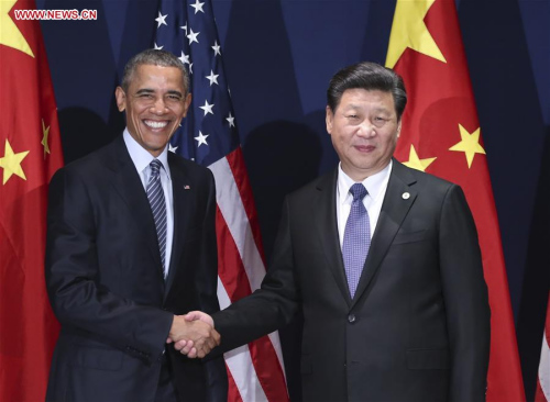 Chinese President Xi Jinping (R) meets with his U.S. counterpart Barack Obama in Paris, France, Nov. 30, 2015. (Photo: Xinhua/Lan Hongguang) 