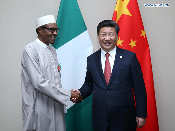 Chinese President Xi Jinping (R) meets with Nigerian President Muhammadu Buhari in Johannesburg, South Africa, Dec. 4, 2015. (Xinhua/Pang Xinglei) Chinese President Xi Jinping (R) meets with Nigerian President Muhammadu Buhari in Johannesburg, South Africa, Dec. 4, 2015. (Xinhua/Pang Xinglei)