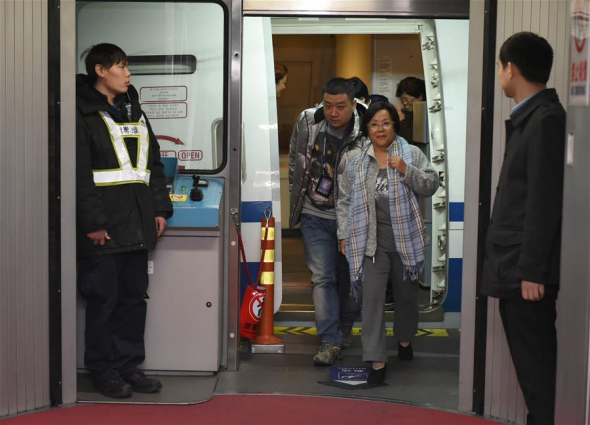 Huang Yurong, 64, one of the suspects from China's most wanted economic fugitives, arrives at Capital International Airport in Beijing, capital of China, Dec. 5, 2015, surrendering herself to the Chinese police after 13 years in the United States.(Photo: Xinhua/Zhou Zhe) Huang Yurong, 64, one of the suspects from China's most wanted economic fugitives, arrives at Capital International Airport in Beijing, capital of China, Dec. 5, 2015, surrendering herself to the Chinese police after 13 years in the United States.(Photo: Xinhua/Zhou Zhe)