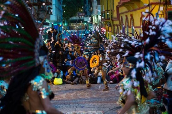 Participants perform during a carnival parade in celebration of the 16th anniversary of Macao's return to motherland and the 10th anniversary of the historical sites listed as World Heritage, in Macao, south China, Dec. 6, 2015. (Xinhua/Cheong Kam Ka) Participants perform during a carnival parade in celebration of the 16th anniversary of Macao's return to motherland and the 10th anniversary of the historical sites listed as World Heritage, in Macao, south China, Dec. 6, 2015. (Xinhua/Cheong Kam Ka)