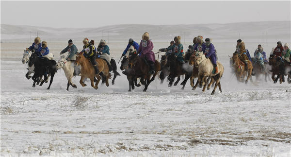 Winter nadam in Xilin Gol League, the Inner Mongolia autonomous region, features a variety of folk sports like horse racing, wrestling and rodeos. (Photos For China Daily/Ma Jianquan) Winter nadam in Xilin Gol League, the Inner Mongolia autonomous region, features a variety of folk sports like horse racing, wrestling and rodeos. (Photos For China Daily/Ma Jianquan)