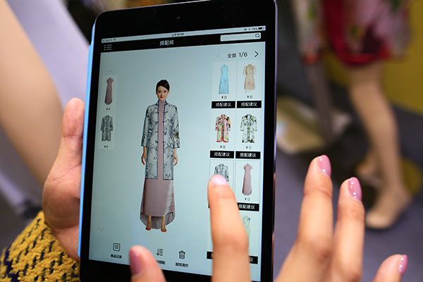 interactive fitting app produced by Jiaxing Getelan Garments Co Ltd is displayed at the Light of Internet Expo at the 2nd World Internet Conference in Wuzhen, Zhejiang province, on December 15, 2015. (Wang Chengmeng/chinadaily.com.cn) interactive fitting app produced by Jiaxing Getelan Garments Co Ltd is displayed at the Light of Internet Expo at the 2nd World Internet Conference in Wuzhen, Zhejiang province, on December 15, 2015. (Wang Chengmeng/chinadaily.com.cn)