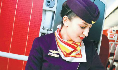 Bazhenova Evgenia, a Russian flight stewardess, 31, has been flying with Hainan Airlines for years. (CAI LINHAO / FOR CHINA DAILY) Bazhenova Evgenia, a Russian flight stewardess, 31, has been flying with Hainan Airlines for years. (CAI LINHAO / FOR CHINA DAILY)