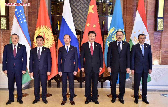 Chinese President Xi Jinping (3rd R) meets with leaders of members of the Shanghai Cooperation Organization (SCO), namely Tajikistan's Prime Minister Qohir Rasulzoda (1st R), Kazakhstan's Prime Minister Karim Masimov (2nd R), Russian Prime Minister Dmitry Medvedev (3rd L), Kyrgyzstan's Prime Minister Temir Sariyev (2nd L) and First Deputy Prime Minister of Uzbekistan Rustam Azimov (1st L), in Wuzhen Town, east China's Zhejiang Province, Dec. 16, 2015. (Photo: Xinhua/Li Tao) Chinese President Xi Jinping (3rd R) meets with leaders of members of the Shanghai Cooperation Organization (SCO), namely Tajikistan's Prime Minister Qohir Rasulzoda (1st R), Kazakhstan's Prime Minister Karim Masimov (2nd R), Russian Prime Minister Dmitry Medvedev (3rd L), Kyrgyzstan's Prime Minister Temir Sariyev (2nd L) and First Deputy Prime Minister of Uzbekistan Rustam Azimov (1st L), in Wuzhen Town, east China's Zhejiang Province, Dec. 16, 2015. (Photo: Xinhua/Li Tao)