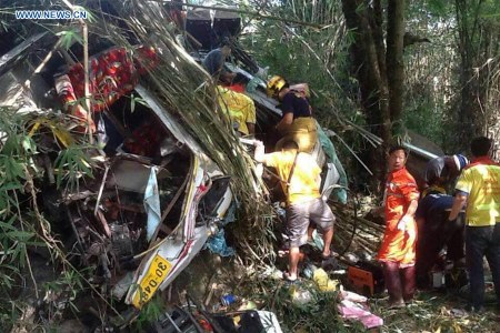 Rescuers work at the bus crash site in Chiang Mai, Thailand, on Dec. 20, 2015. A tour bus carrying 25 people crashed in northern Thailand's Chiang Mai Province on Sunday morning, killing 13 people, including 12 Malaysian tourists and one Thai tour guide, the Chinese Consulate General in Chiang Mai said. (Xinhua) Rescuers work at the bus crash site in Chiang Mai, Thailand, on Dec. 20, 2015. A tour bus carrying 25 people crashed in northern Thailand's Chiang Mai Province on Sunday morning, killing 13 people, including 12 Malaysian tourists and one Thai tour guide, the Chinese Consulate General in Chiang Mai said. (Xinhua)
