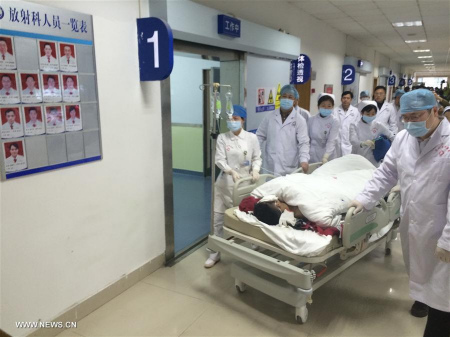 Tian Zeming, a survivor found in the landslide site, receives medical treatment at a hospital in Shenzhen, south China's Guangdong Province, Dec. 23, 2015. Tian was pulled out alive early Wednesday morning more than 60 hours after a landslide in Shenzhen. (Xinhua/Sun Fei) Tian Zeming, a survivor found in the landslide site, receives medical treatment at a hospital in Shenzhen, south China's Guangdong Province, Dec. 23, 2015. Tian was pulled out alive early Wednesday morning more than 60 hours after a landslide in Shenzhen. (Xinhua/Sun Fei)
